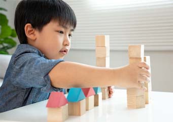 Little boy playing with blocks